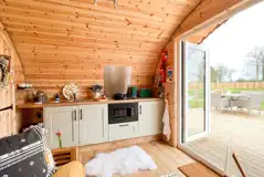 Glencroft kitchen with a microwave, grill, hob, sink and fridge