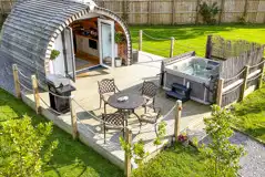 Aerial of Chaplins Club pod with a BBQ, outdoor seating and electric hot tub