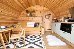 Glencroft pod living area and kitchen area with a double sofa bed