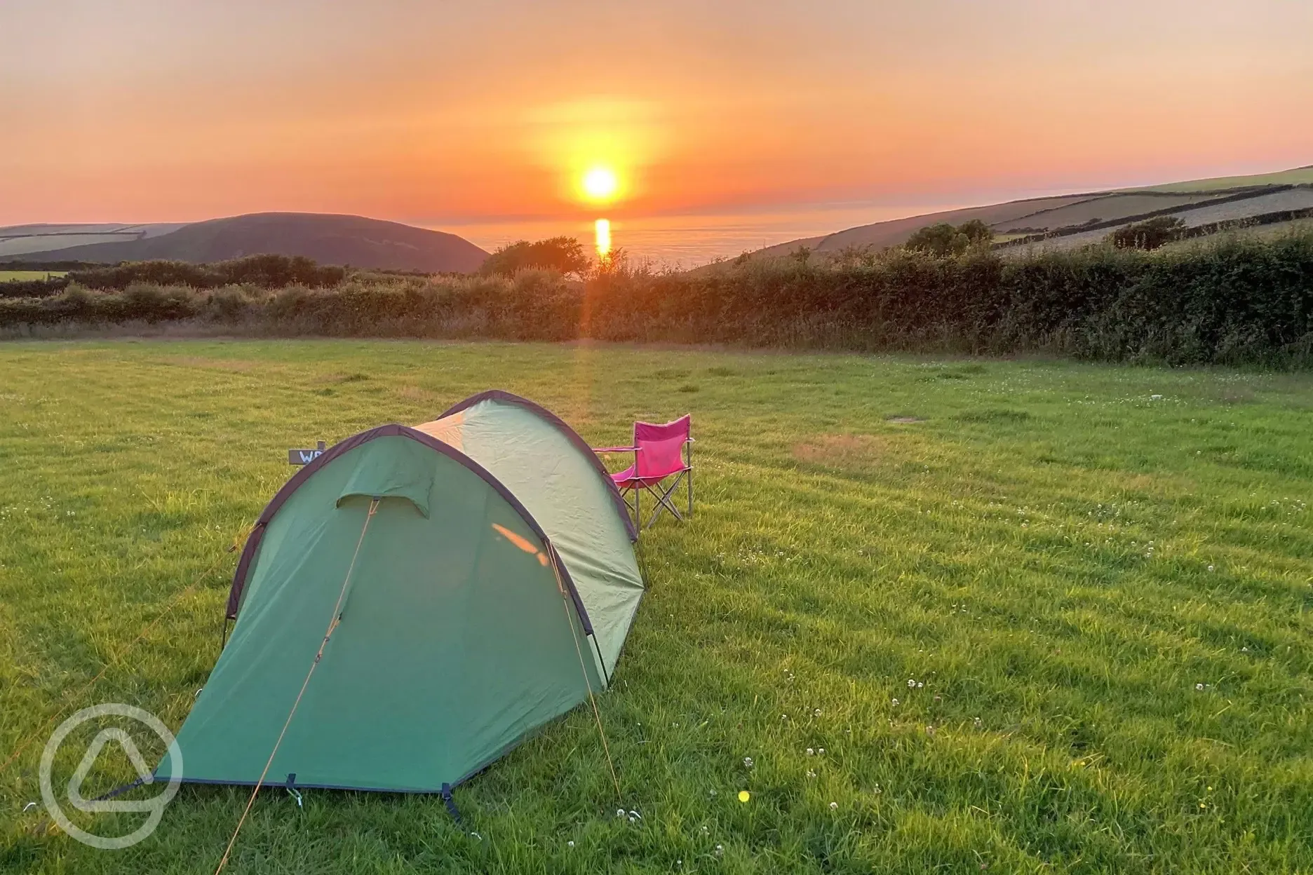 Non electric grass tent pitches at sunset