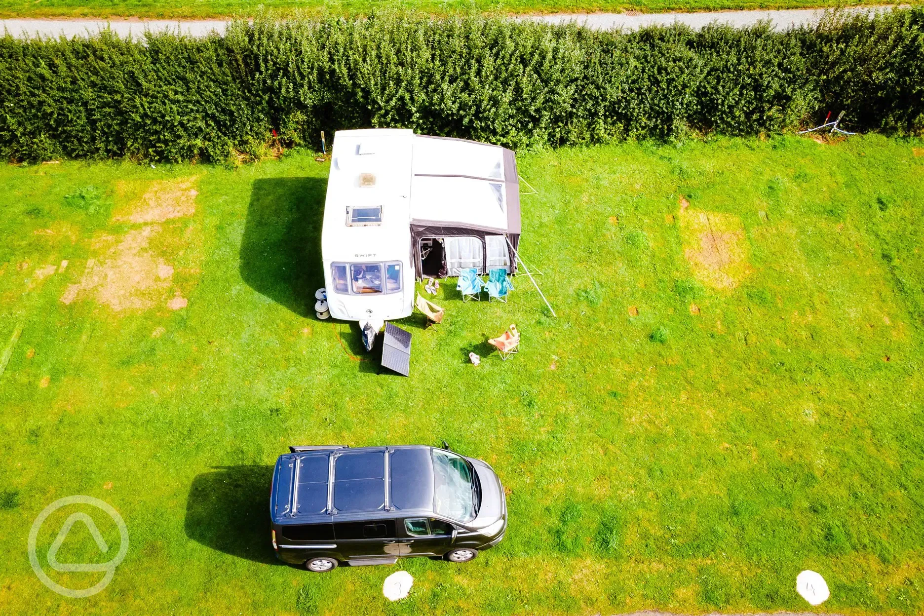 A caravan with an awning on the non electric grass pitches