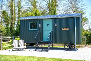 Rusty shepherd's hut at Bucket and Spade Holidays Touring