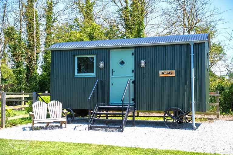 Rusty shepherd's hut at Bucket and Spade Holidays Touring