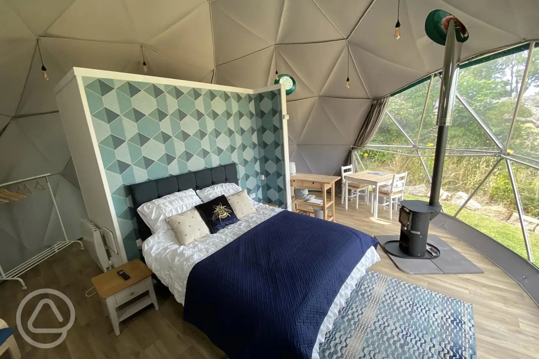 Geodesic dome interior with wood burning stove