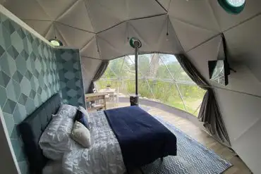 Geodesic dome interior with wood burning stove