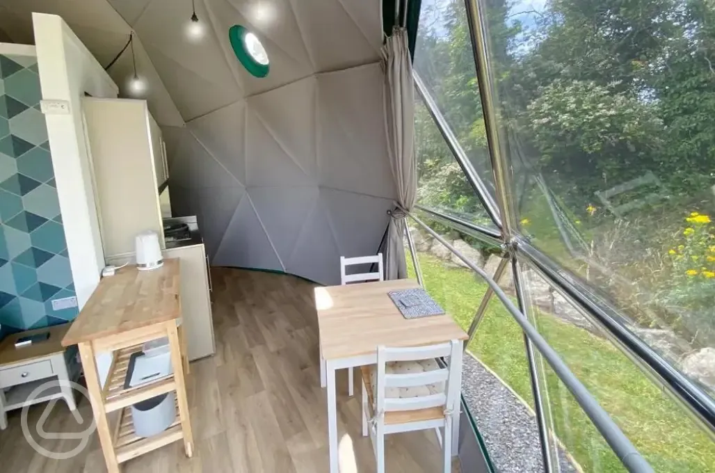 Geodesic dome kitchen and seating area