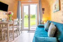 Awel-Deg glamping pod kitchenette and dining area with a smart TV Awel-Deg glamping pod kitchenette and dining area with a smart TV