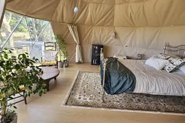 Geodome interior with a double bed