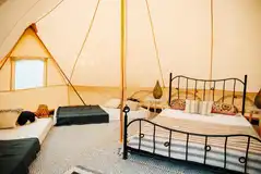 Gwenllian Emperor bell tent with a double bed and two single mattresses Gwenllian Emperor bell tent with a double bed and two single mattresses