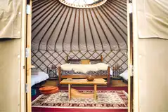 Elinir yurt with a double bed and two single mattresses