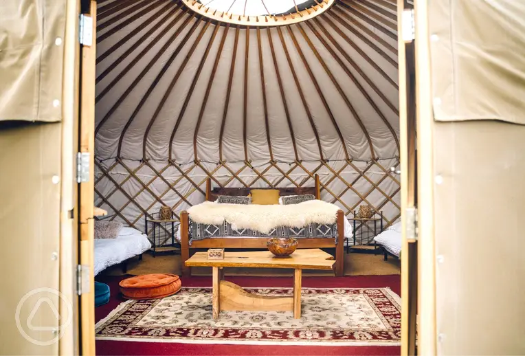 Elinir yurt with a double bed and two single mattresses