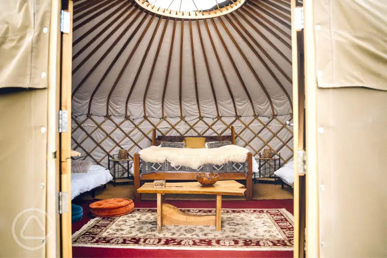 Elinir yurt with a double bed and two single mattresses