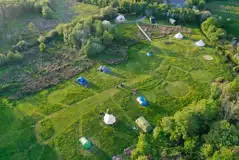 Aerial view of the campsite with circular mown pitches