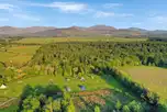 Aerial view of Cae Lal with views to the Snowdonia/Eryri mountains