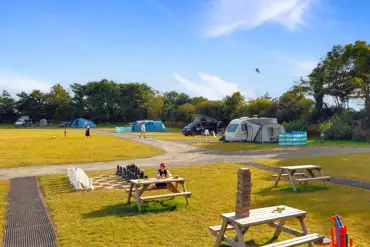 Onsite games and seating beside the hardstandings at Presaddfed - Druids' Rest