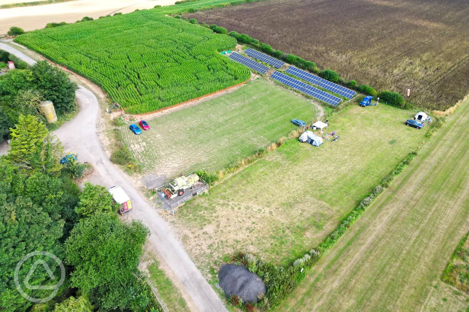 Aerial of the pitches, maize mase and pathway leading to the ice cream parlour