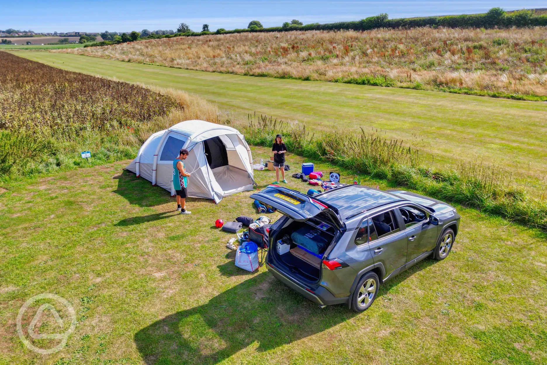 Electric grass pitches (outer field) measuring 14m by 10m