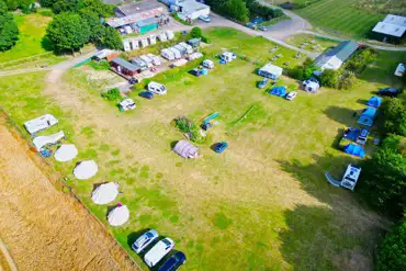 Aerial of pitches, facilities and pub at Solley's Ice Cream Campsite