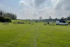 Electric grass pitches (main field) with picnic bench seating by the pub