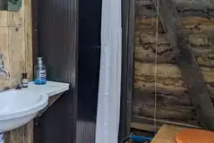 Shower, compost toilet, and hand washing sink