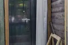 Shower with a chair and clothing hook