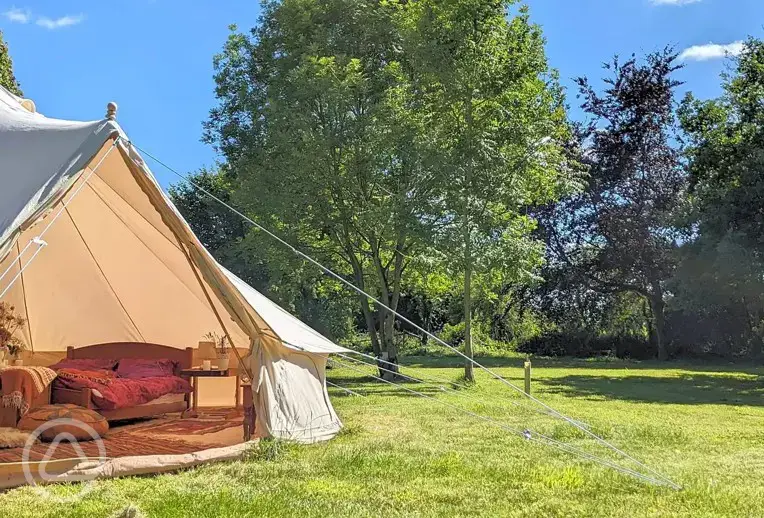 Deluxe 6m furnished bell tent with a king size bed at North Down Orchard