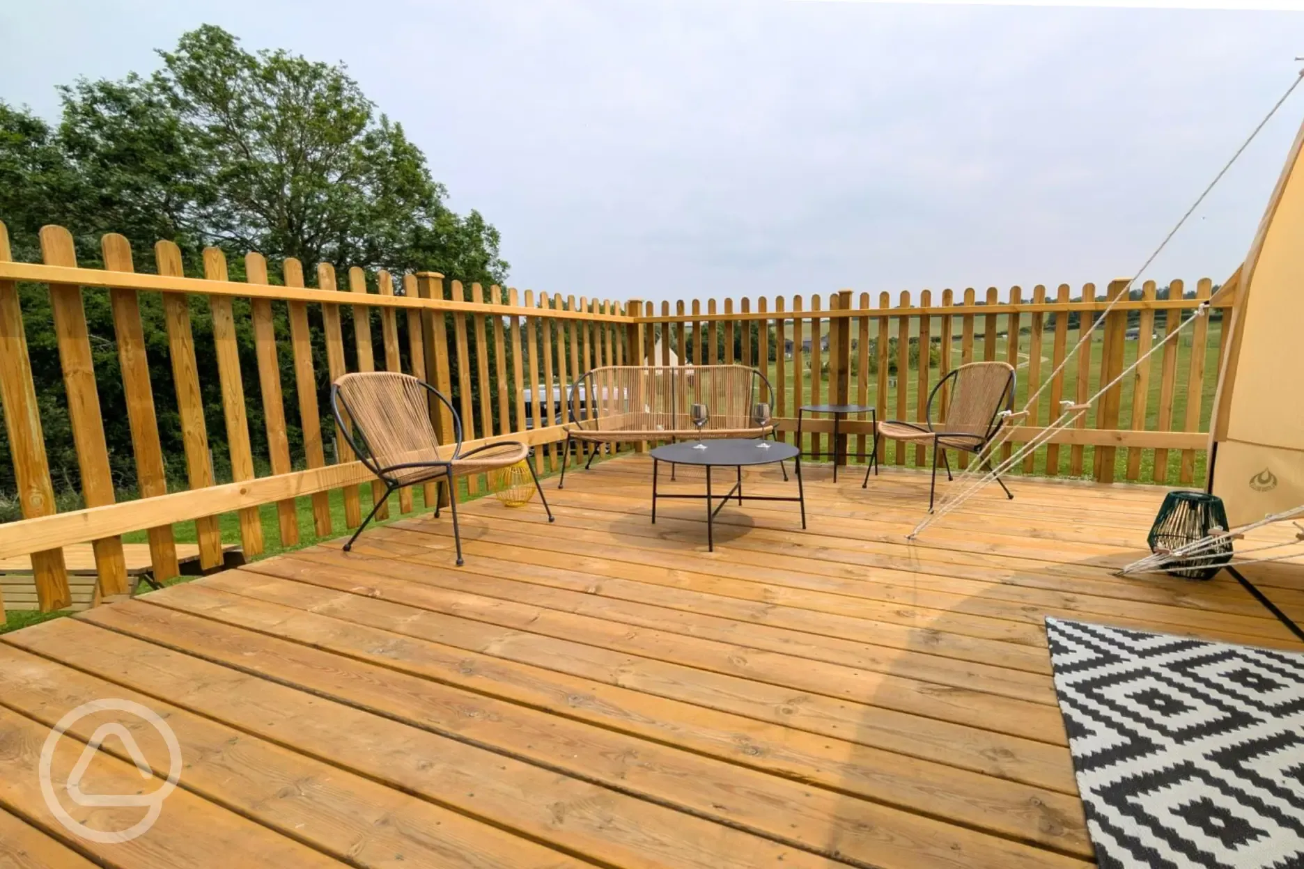 Lotus stargazer bell tent decking and outdoor furniture