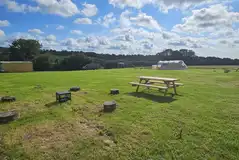 Non electric grass tent pitches with picnic tables Non electric grass tent pitches with picnic tables