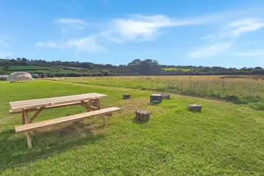 Non electric grass tent pitches with picnic tables
