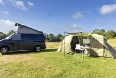 Pop-top campervan and tent on the non electric grass pitches