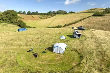 Aerial of the non electric grass pitches mown in to the meadow grass