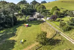 Aerial of the grass pitches by the barn and facilities building
