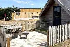 Glamping pod fencing with private patio and picnic bench Glamping pod fencing with private patio and picnic bench