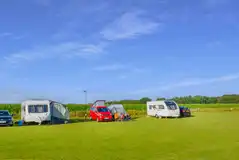 Electric grass pitches with 16 amp electric hook up at Abdo Hill Farm
