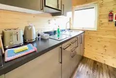 Carrock Squirrel Glamping Pod kitchen with a sink, kettle, toaster, and more Carrock Squirrel Glamping Pod kitchen with a sink, kettle, toaster, and more