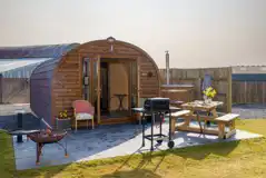 Carrock Sunset Glamping Pod featuring a fire pit, BBQ, and picnic bench Carrock Sunset Glamping Pod featuring a fire pit, BBQ, and picnic bench
