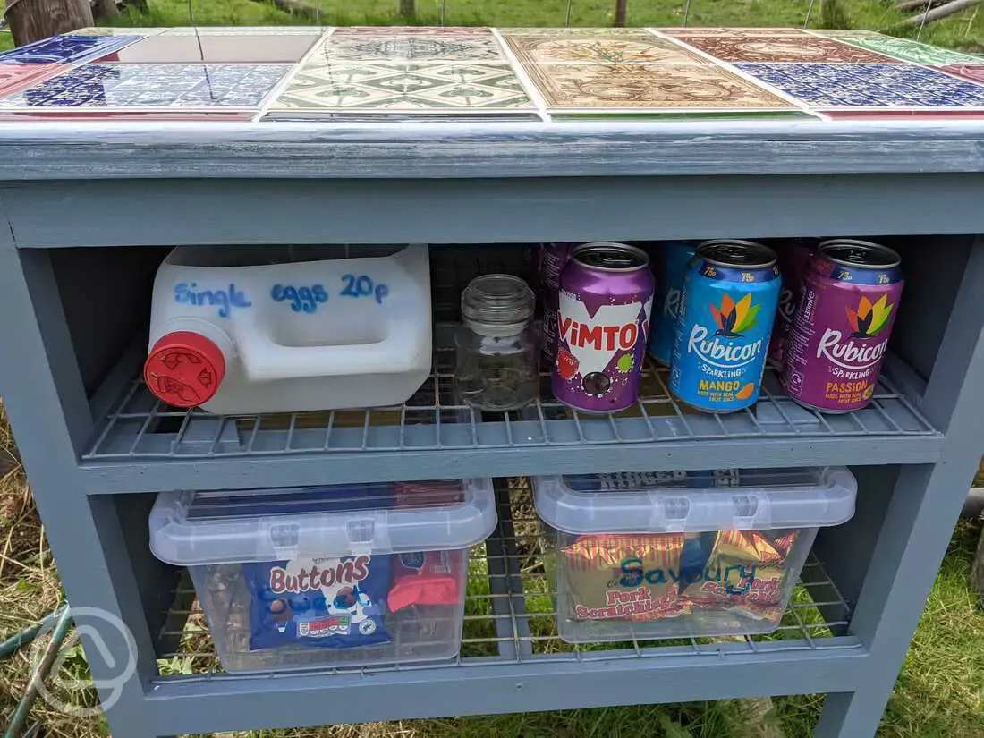 Honesty table with fresh eggs and snacks for sale