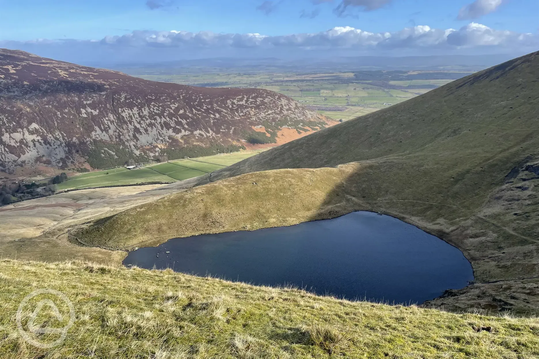 Bowscale tarn for wild swimming at Mosedale End Farm 