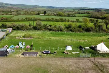 Aerial of the bell tents and non electric grass pitches at Flowerdew Farm