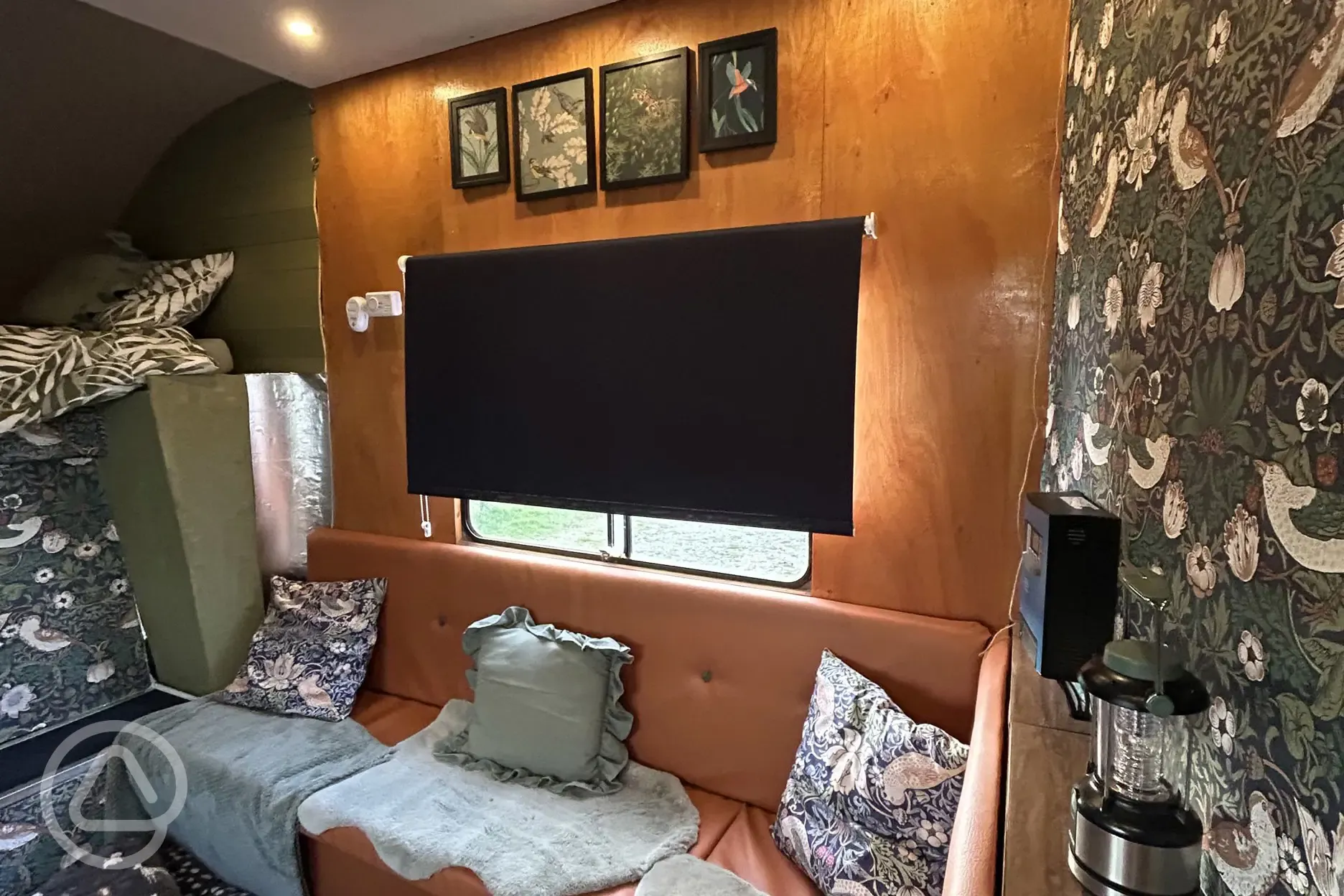 Converted horsebox living area with sofa seating