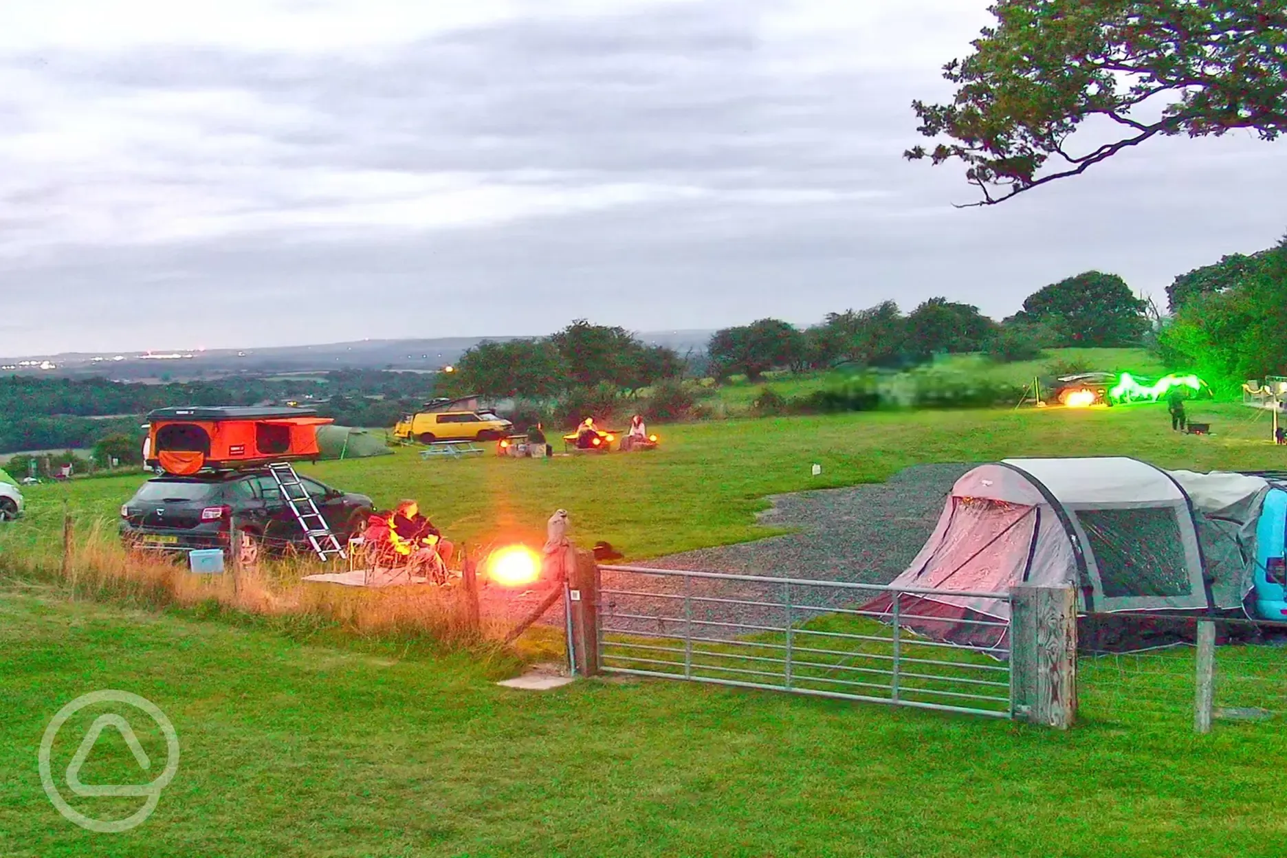 Grass pitches with roof tents, awning space and campfires (optional electric) Grass pitches with roof tents, awning space and campfires (optional electric)