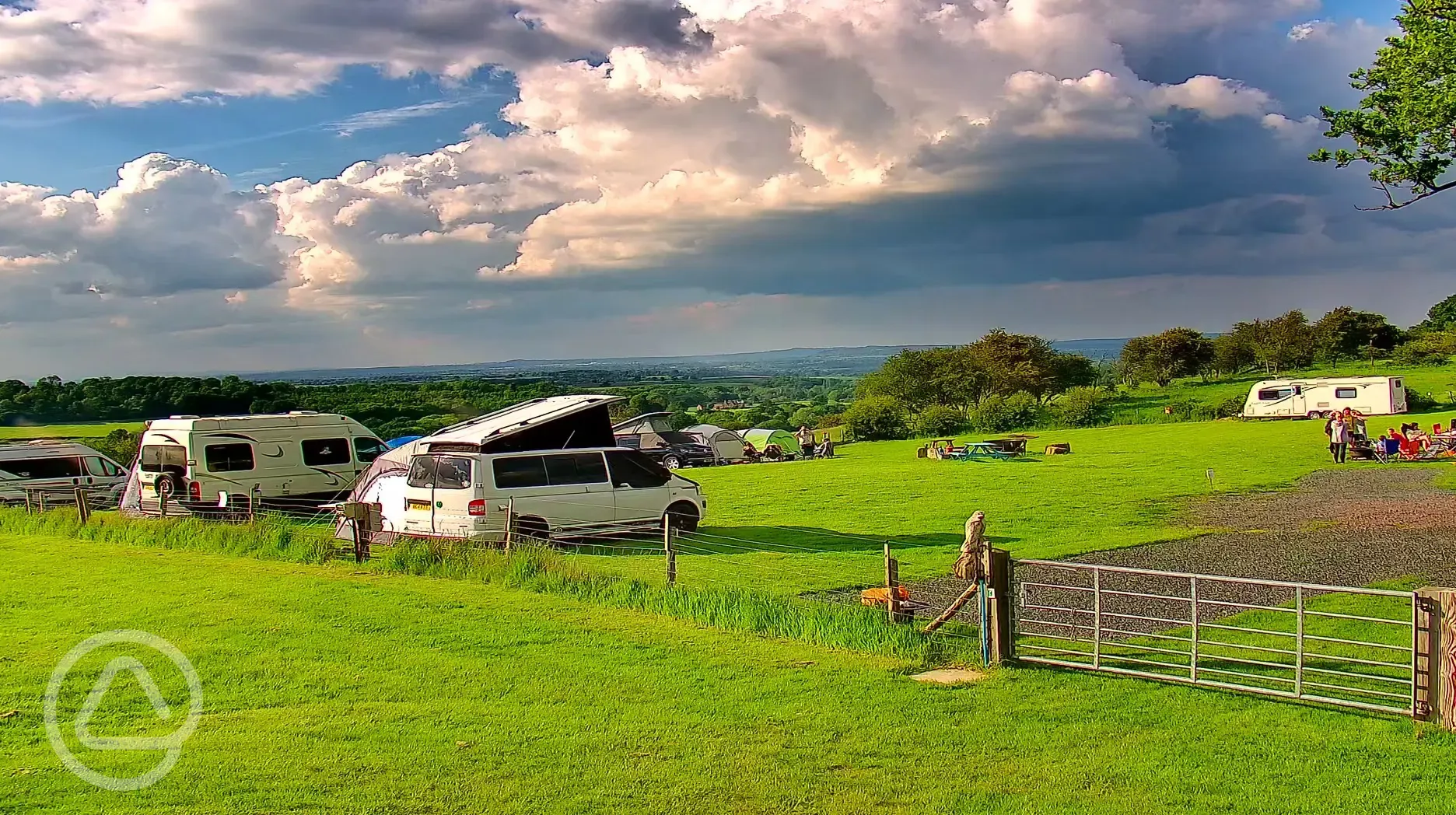 Small campervans on the main field with amazing views.