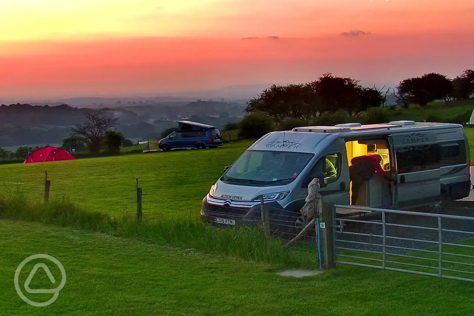 LWB Campervan on Hardstanding with sunset view