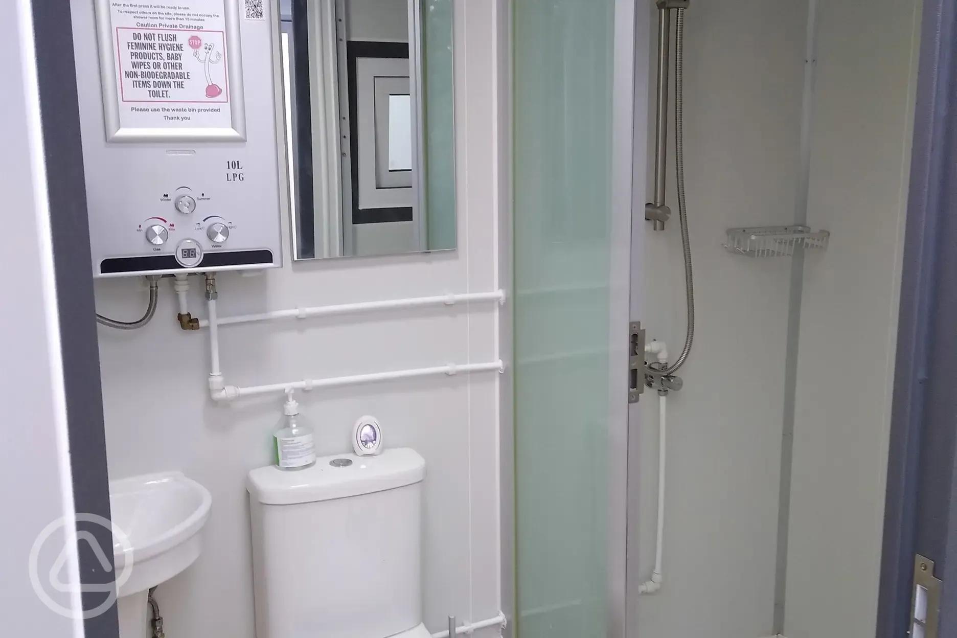 Toilet and shower facilities with hand and hair driers.