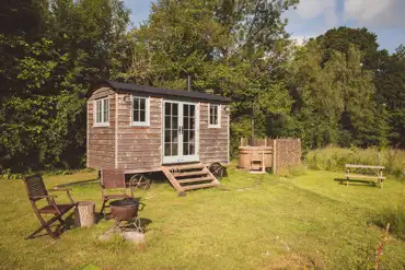 Yarrow shepherd's hut with hot tub at Knowle Meadow Camping