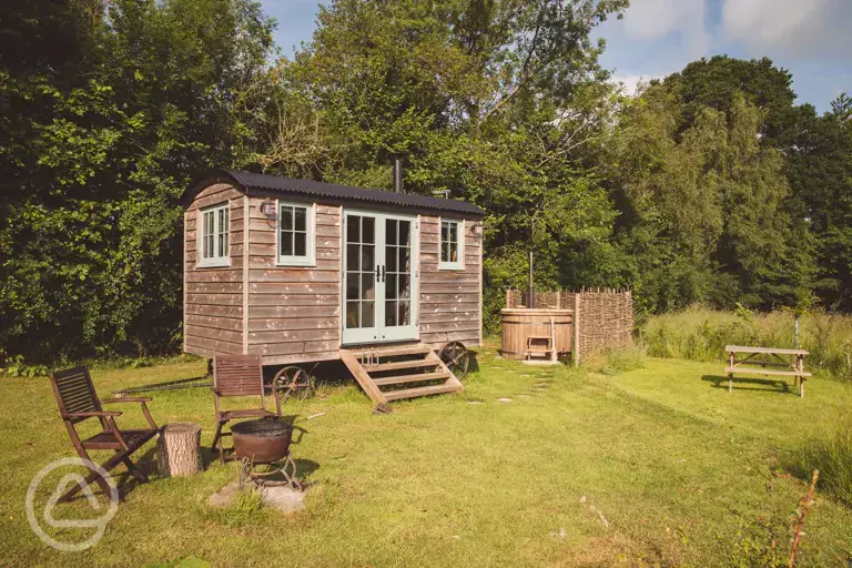 Yarrow shepherd's hut with hot tub at Knowle Meadow Camping