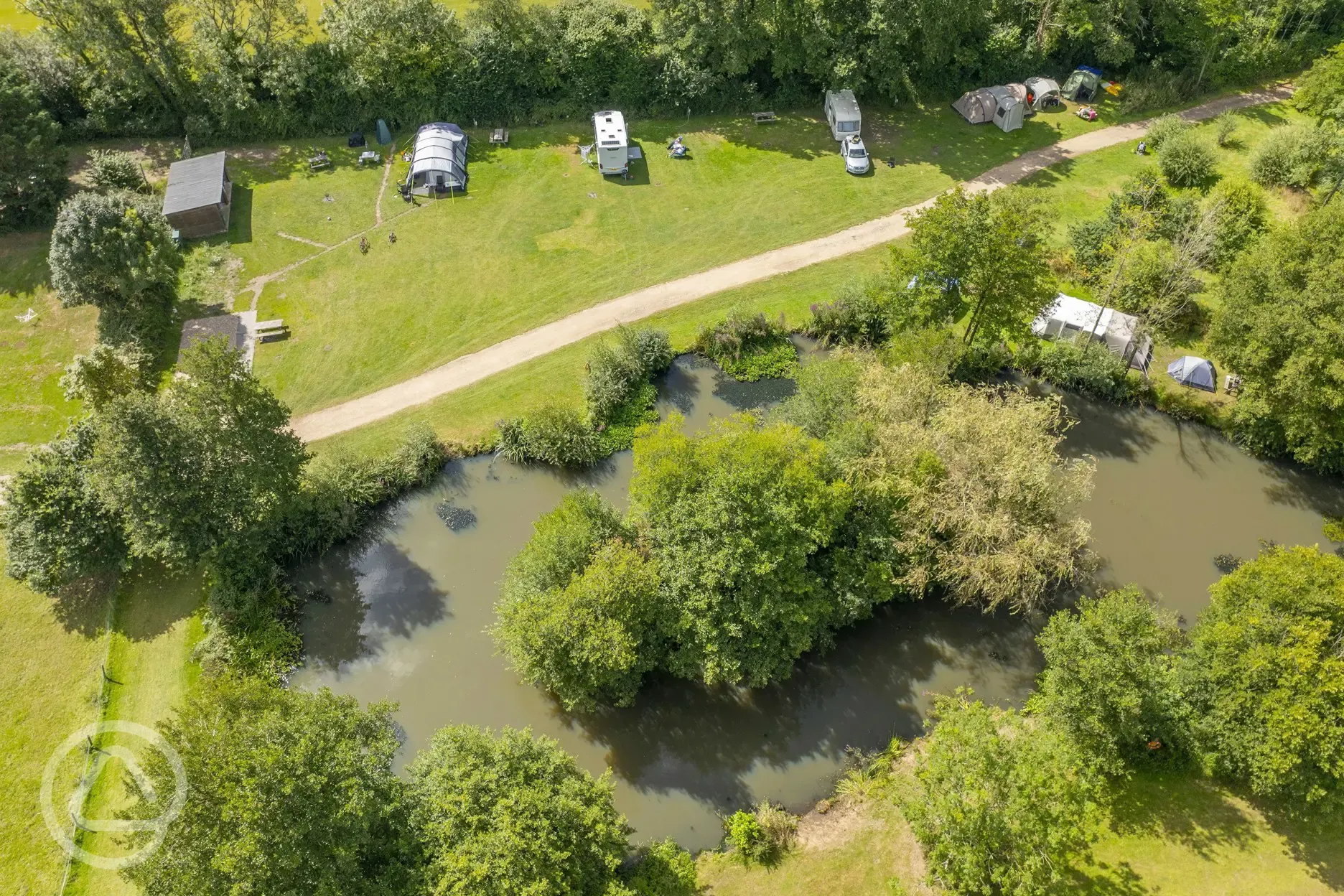 Aerial of the electric grass touring pitches and lake