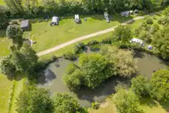 Aerial of the electric grass touring pitches and lake