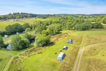 Aerial of the grass pitches at Riverside Lakes set amongst mown grass