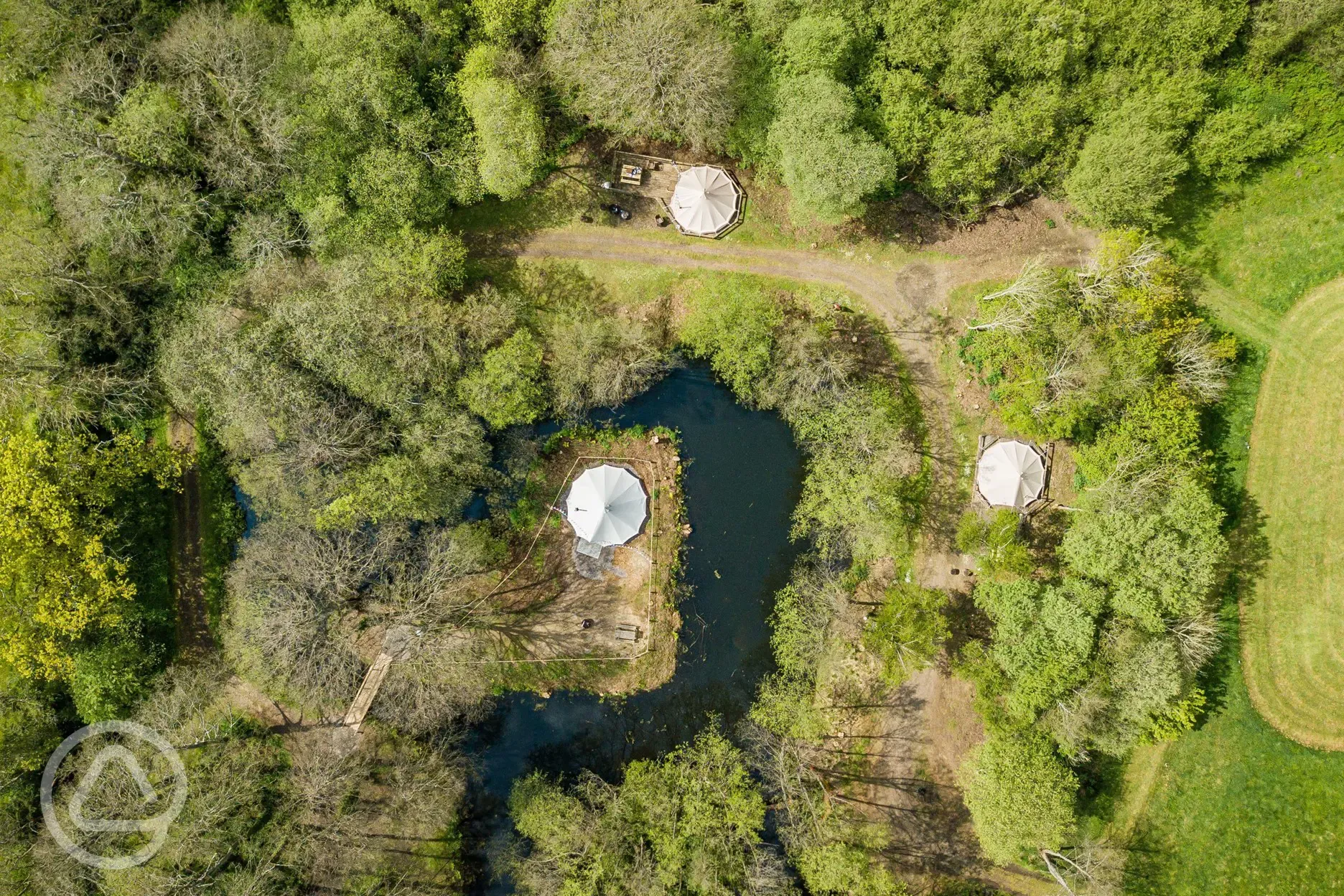 Bird's eye view of the bell tents and lake